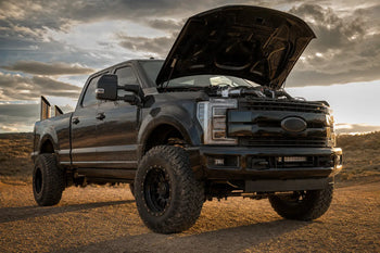 Ford 6.7L Powerstroke Super Duty with diesel delete kit installed on off-road trail