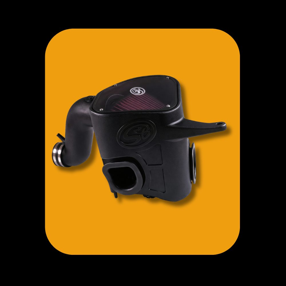 S&B cold air intake system installed on Ram Cummins 6.7L diesel engine, 2013-2018 model years.
